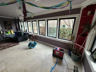 Garbage truck driving past office buildings