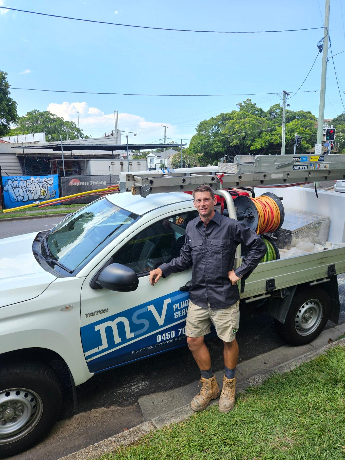 Owner of MSV Plumbing Services Matt next to his plumbing vehicle