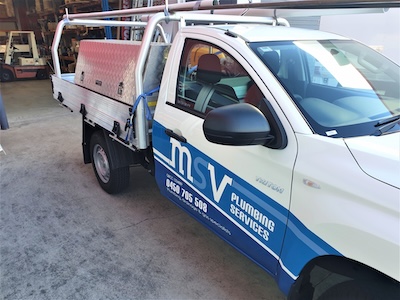 MSV Plumbing Services emergency plumbing vehicle, a white utility van with company branding and tools, parked ready for urgent plumbing repairs in Coorparoo.