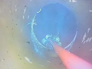 CCTV drain camera footage showing high pressure jetting inside a blocked sewer pipe during professional drain cleaning in Coorparoo.