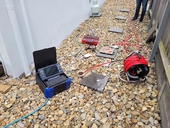 CCTV drain camera inspection equipment used by Coorparoo plumbers for blocked drains outside a residential home.