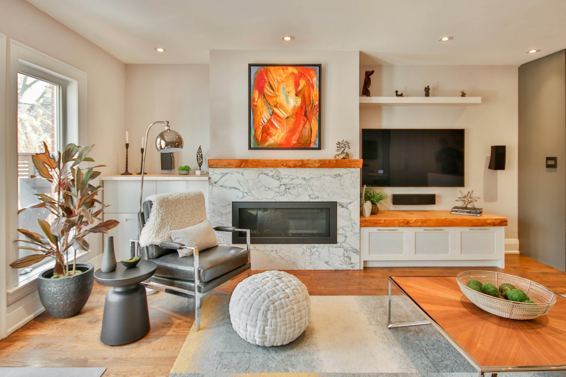 Large abstract painting installed in a luxury modern living room