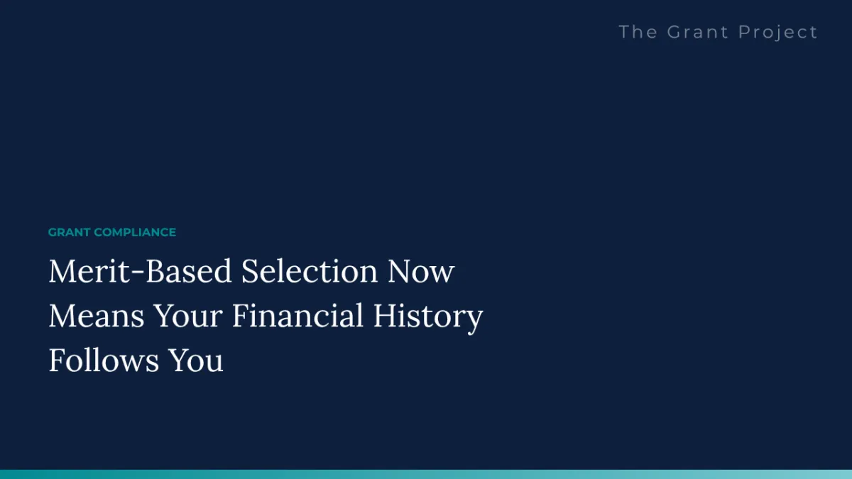 A grants director reviewing audit findings and financial management history ahead of a federal application under the 2026 merit-based selection standard