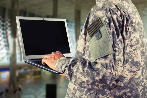 Military Personnel with Laptop