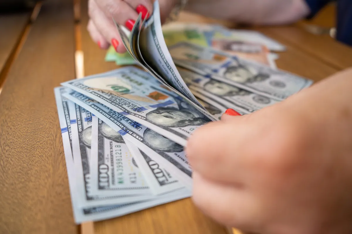 a white house with a tree in front of it