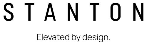 Stanton logo with the tagline "Elevated by design," representing high-quality interior design services and area rugs for stylish home transformations.