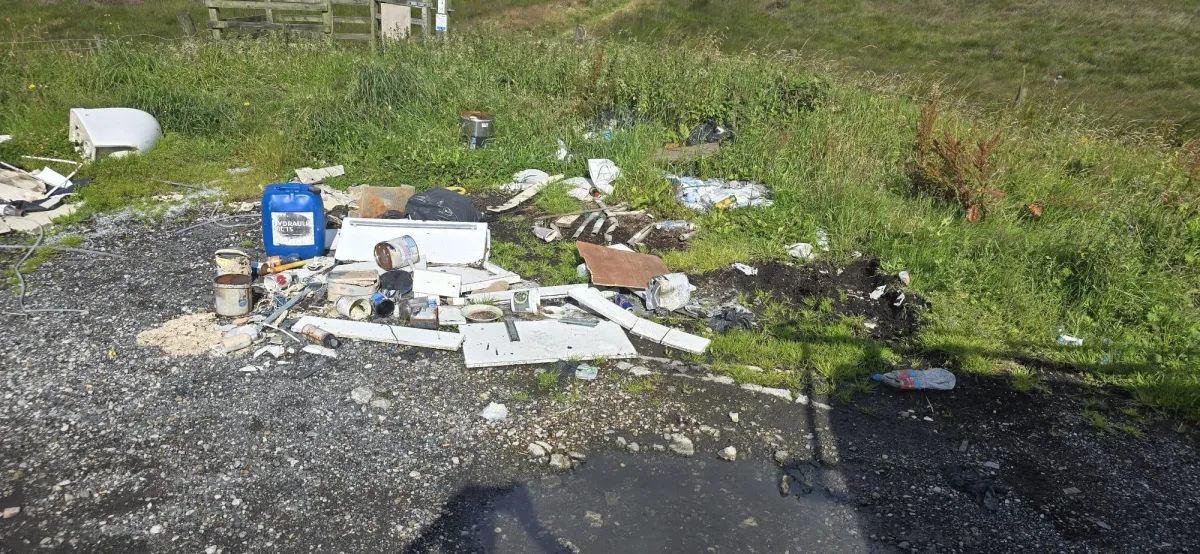 Rubbish left for collection on a driveway in Huddersfield 