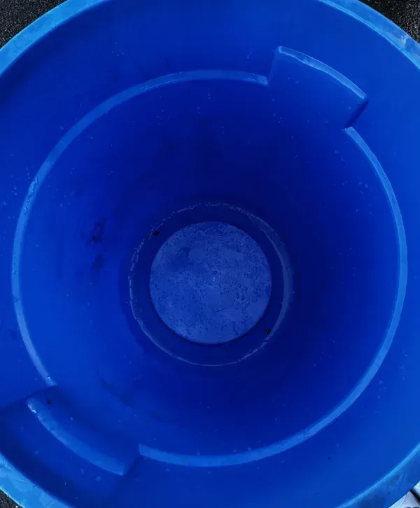 interior of blue trash can