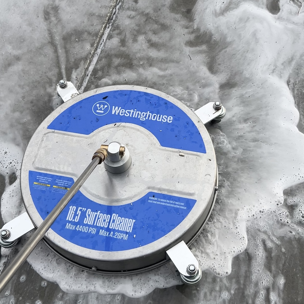 Commercial concrete surface cleaning using a professional surface cleaner and eco-friendly detergent foam to remove heavy grime and discoloration. Elite Hydro Works provides efficient, streak-free cleaning for commercial properties and high-traffic areas.