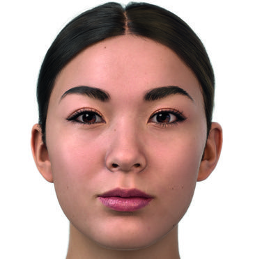 Three women sitting on a couch reading a book