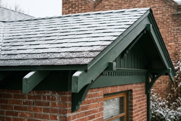 Clean pristine roofline with hidden heat panels on Sugar House craftsman bungalow, Utah
