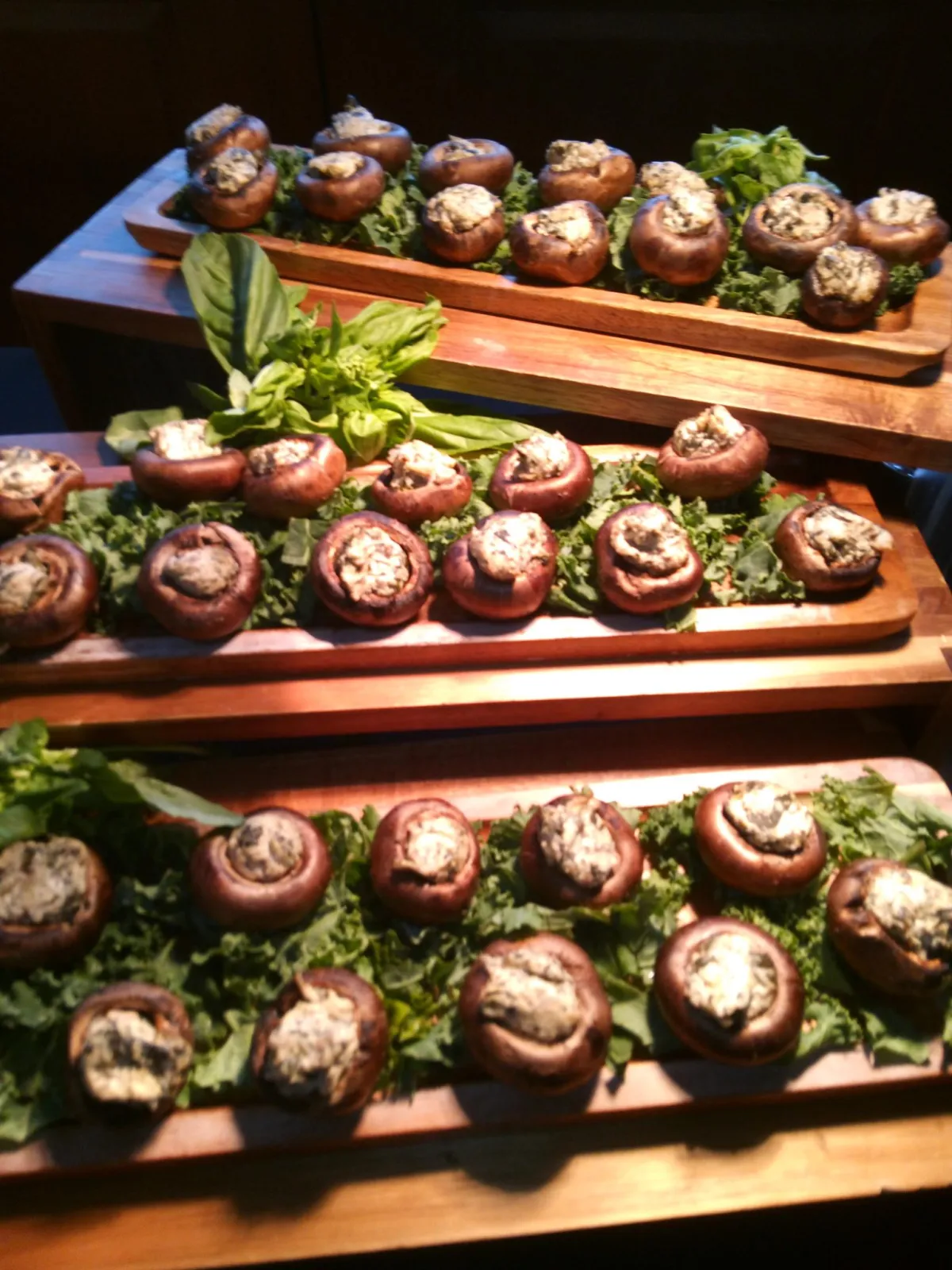red tomato beside green leaves