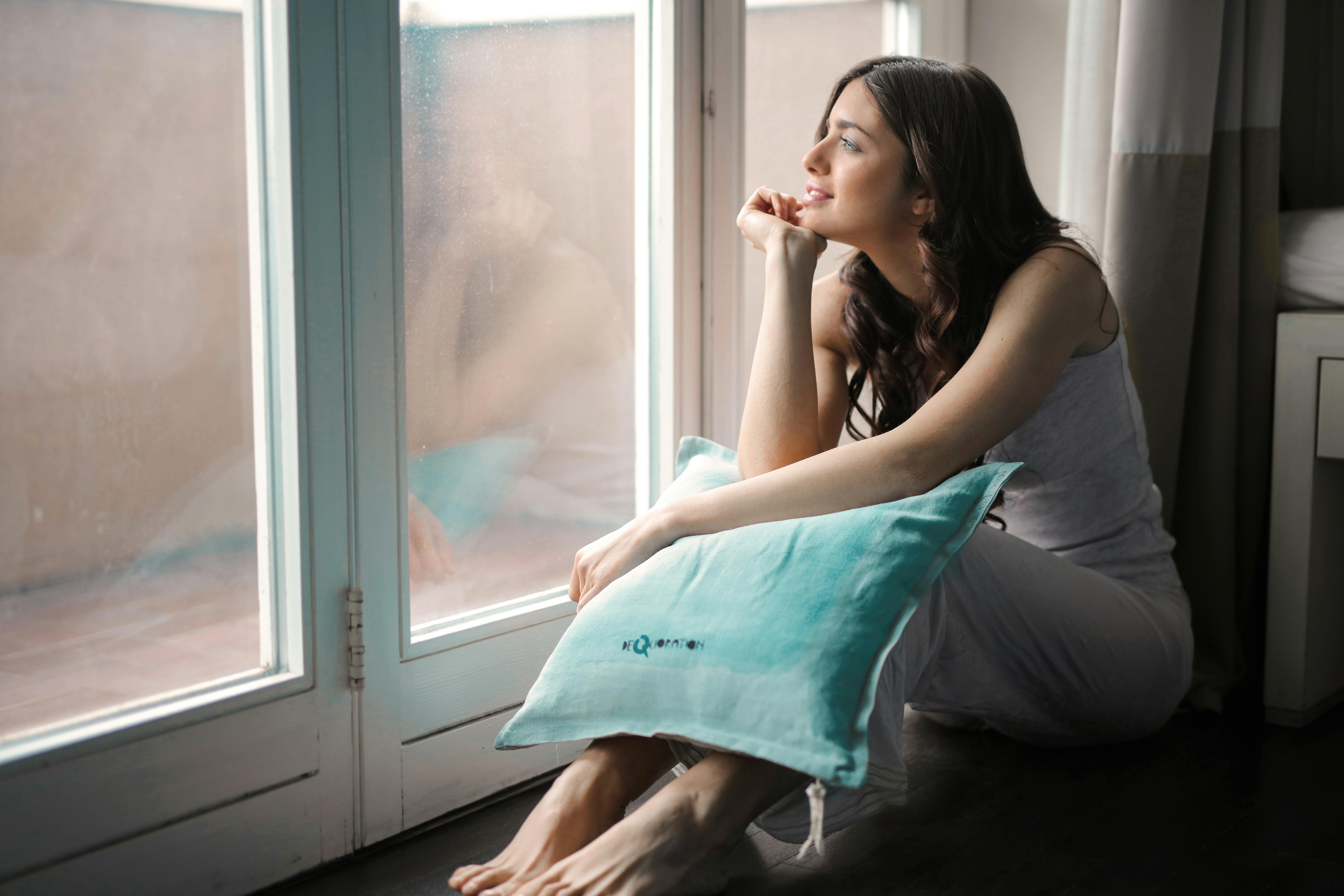 woman looking out the window
