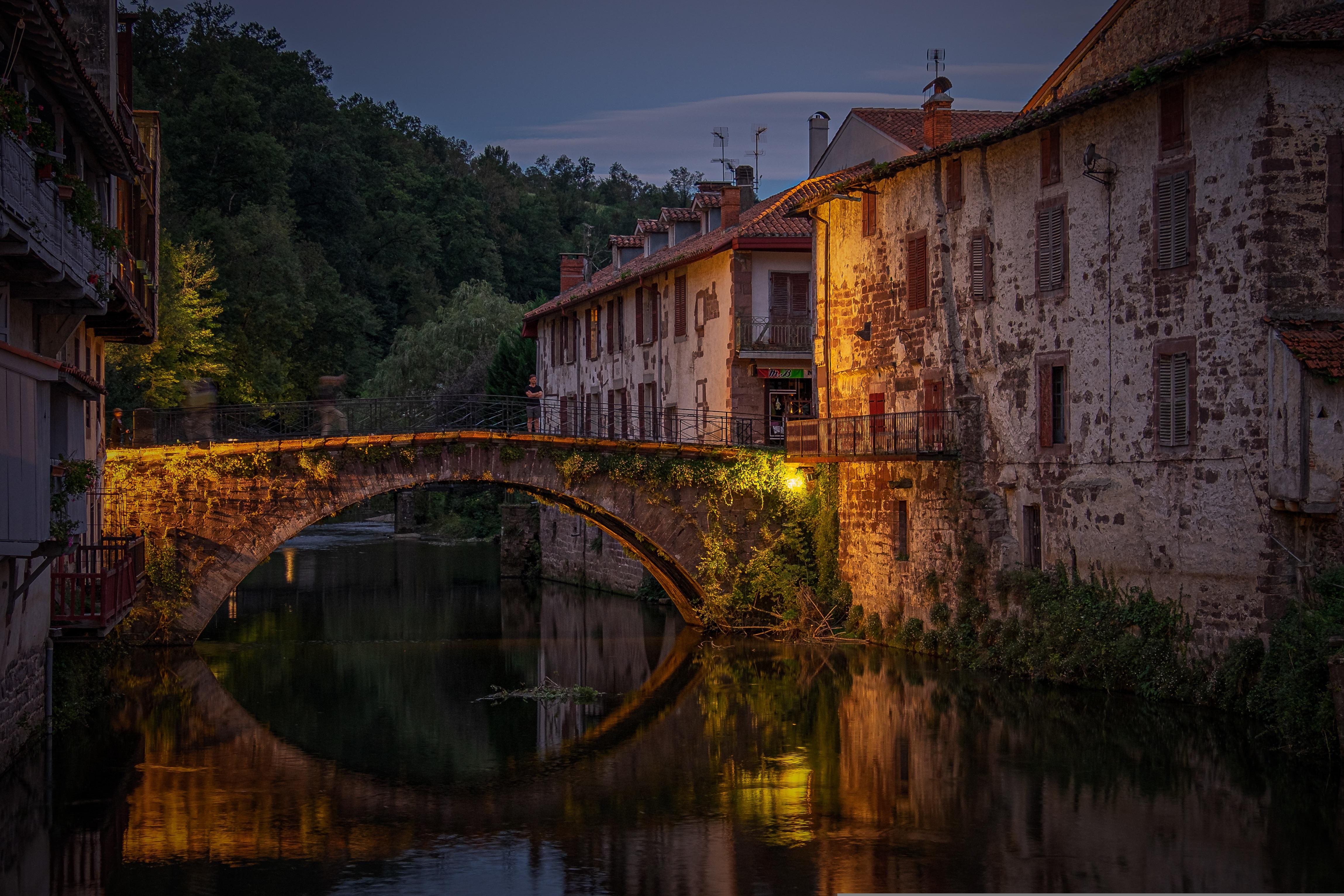 sunset over european medieval bridge