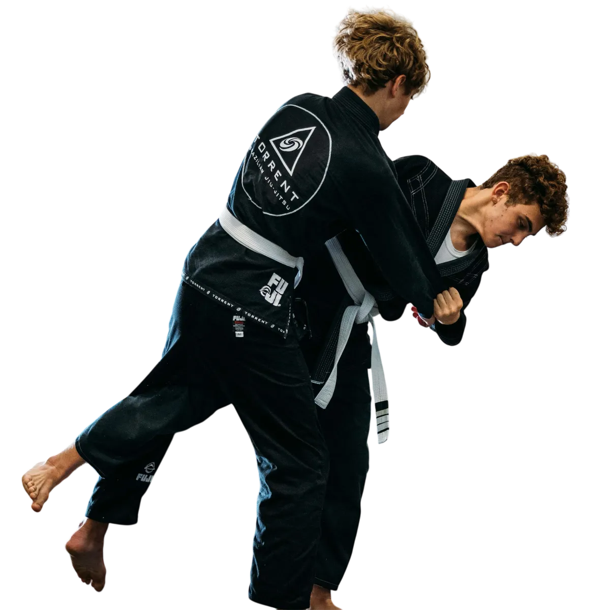 Two adults grappling during Brazilian Jiu-Jitsu training at Torrent BJJ in Hanover Pembroke, MA, improving fitness, strength, and body control
