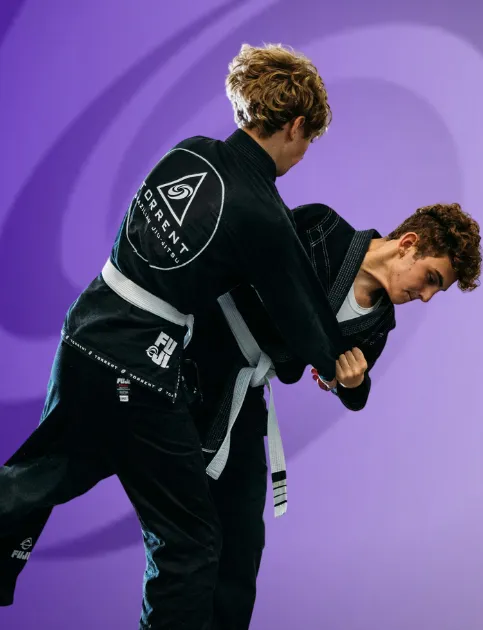 Students practicing Judo throws and techniques during a youth martial arts class at Torrent BJJ in Hanover, MA