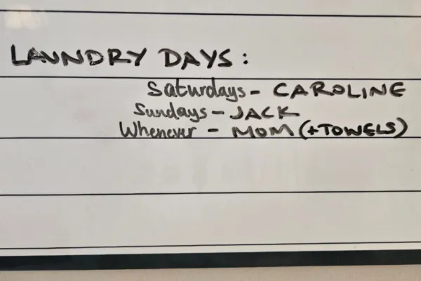 Whiteboard calendar of laundry days, leaving mom's day as whenever
