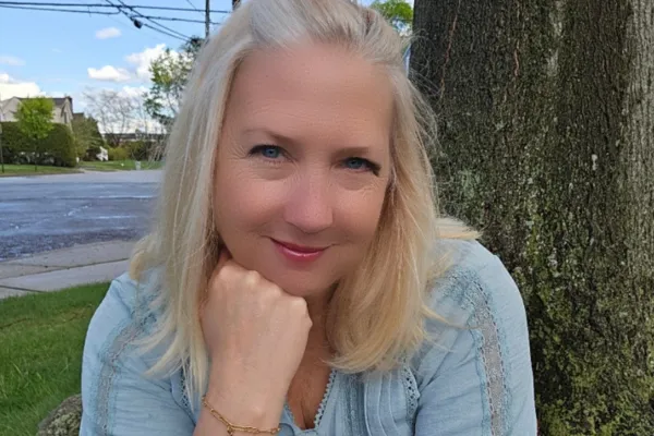 Life coach Steph Koenig looking at the camera, for a blog post on rest, burnout, and permission to slow down.