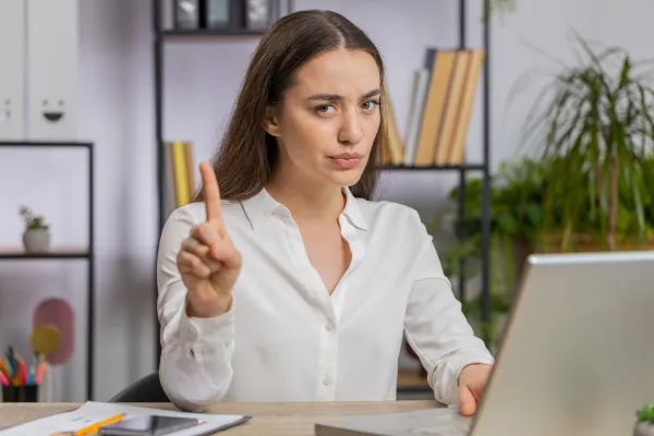 Woman at her desk saying no with confidence