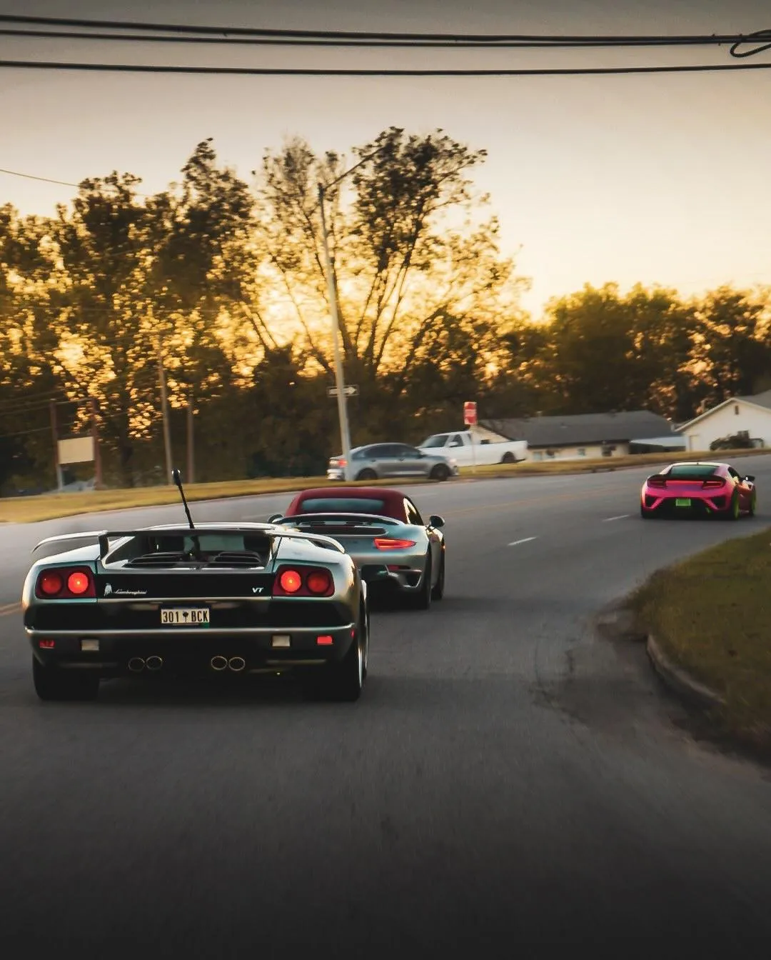 exotic cars driving on an off ramp