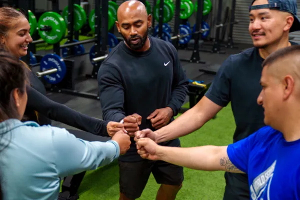 Group fitness class huddle