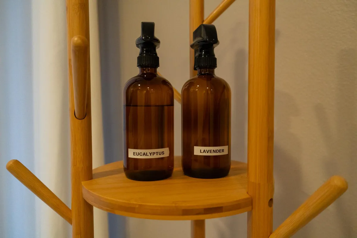 Eucalyptus and lavender essential oil bottles in sauna at Primitive x Swole AF Garden Grove