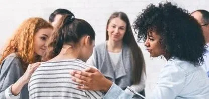 Compassionate therapist engaging in a supportive counseling session with a client