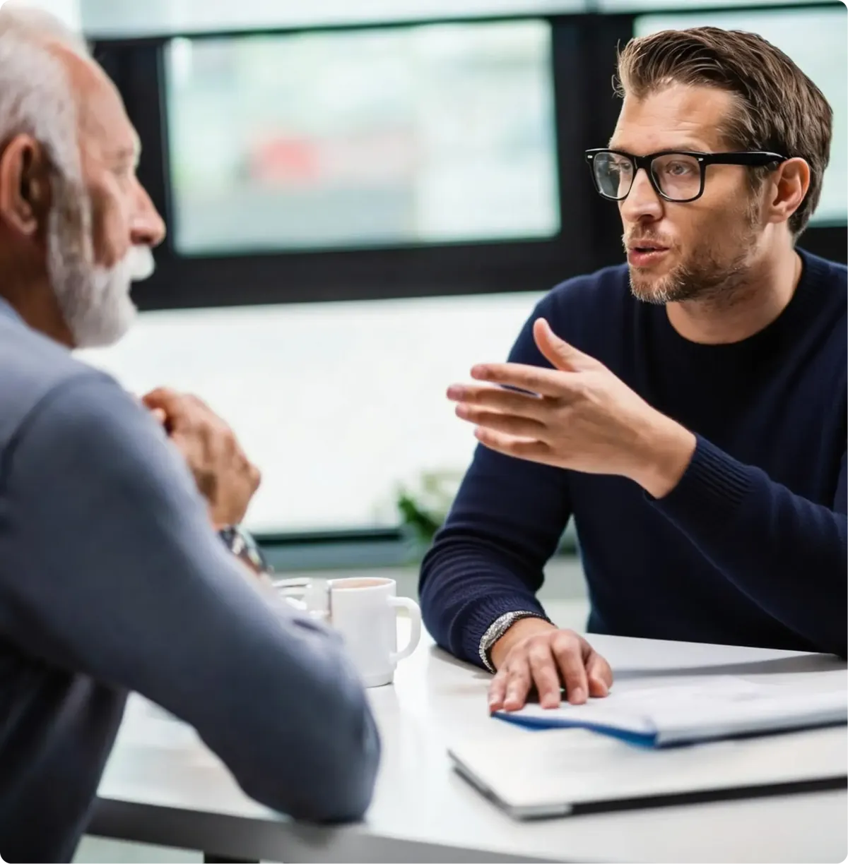 Two men talking about the health of a patient