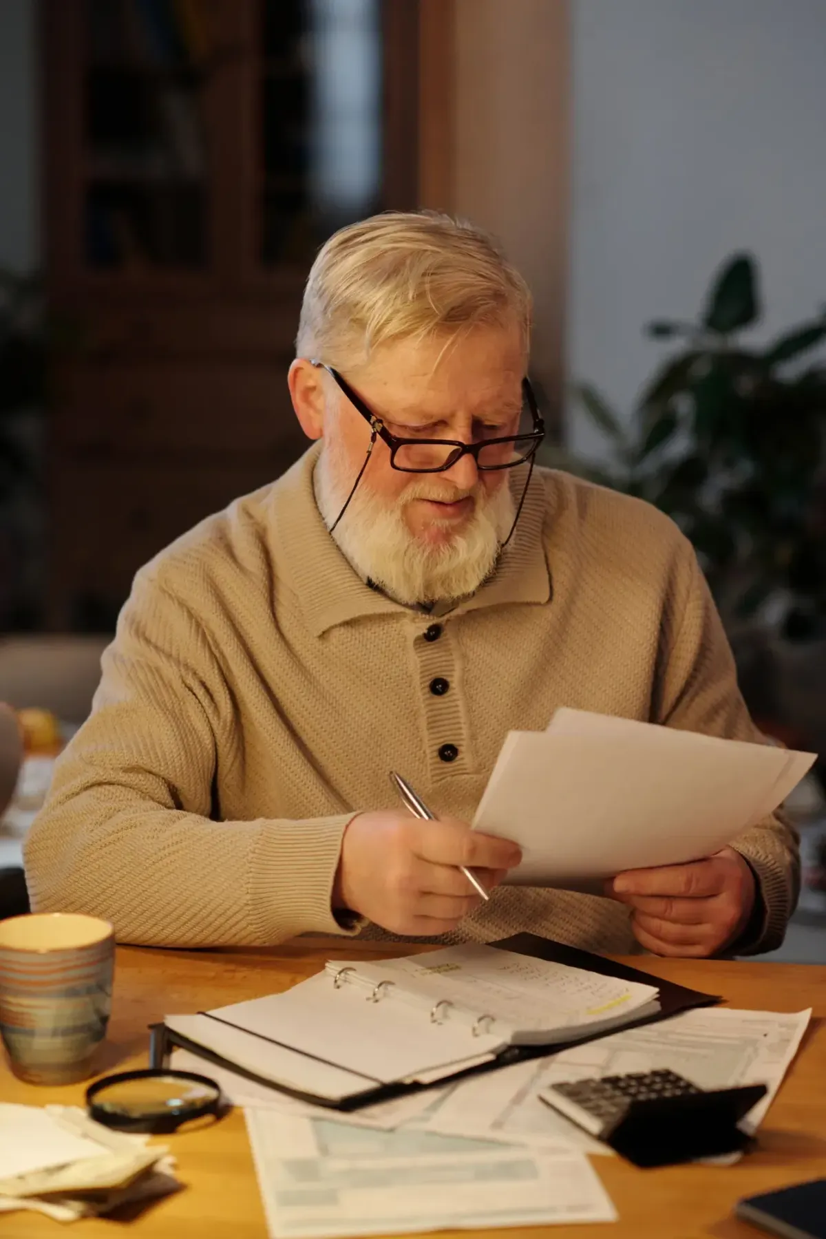 Male looking at paperwork.