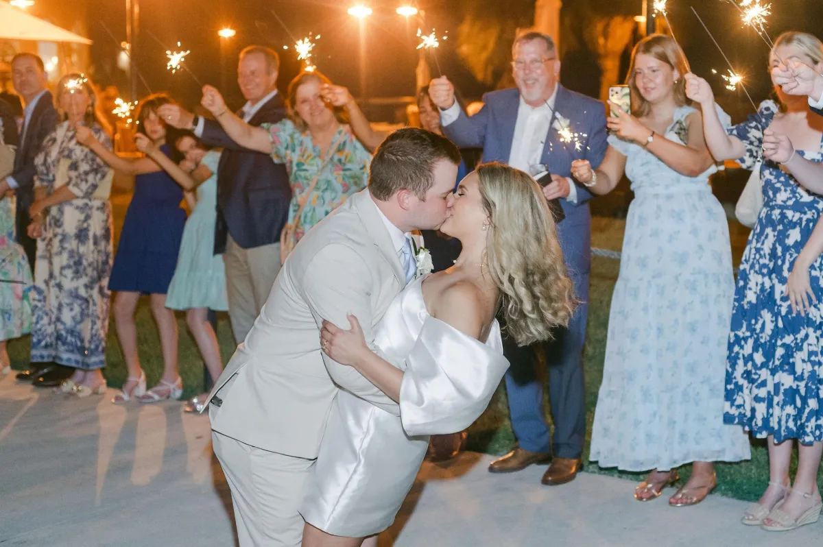 a large white and red boat floating on top of a lake