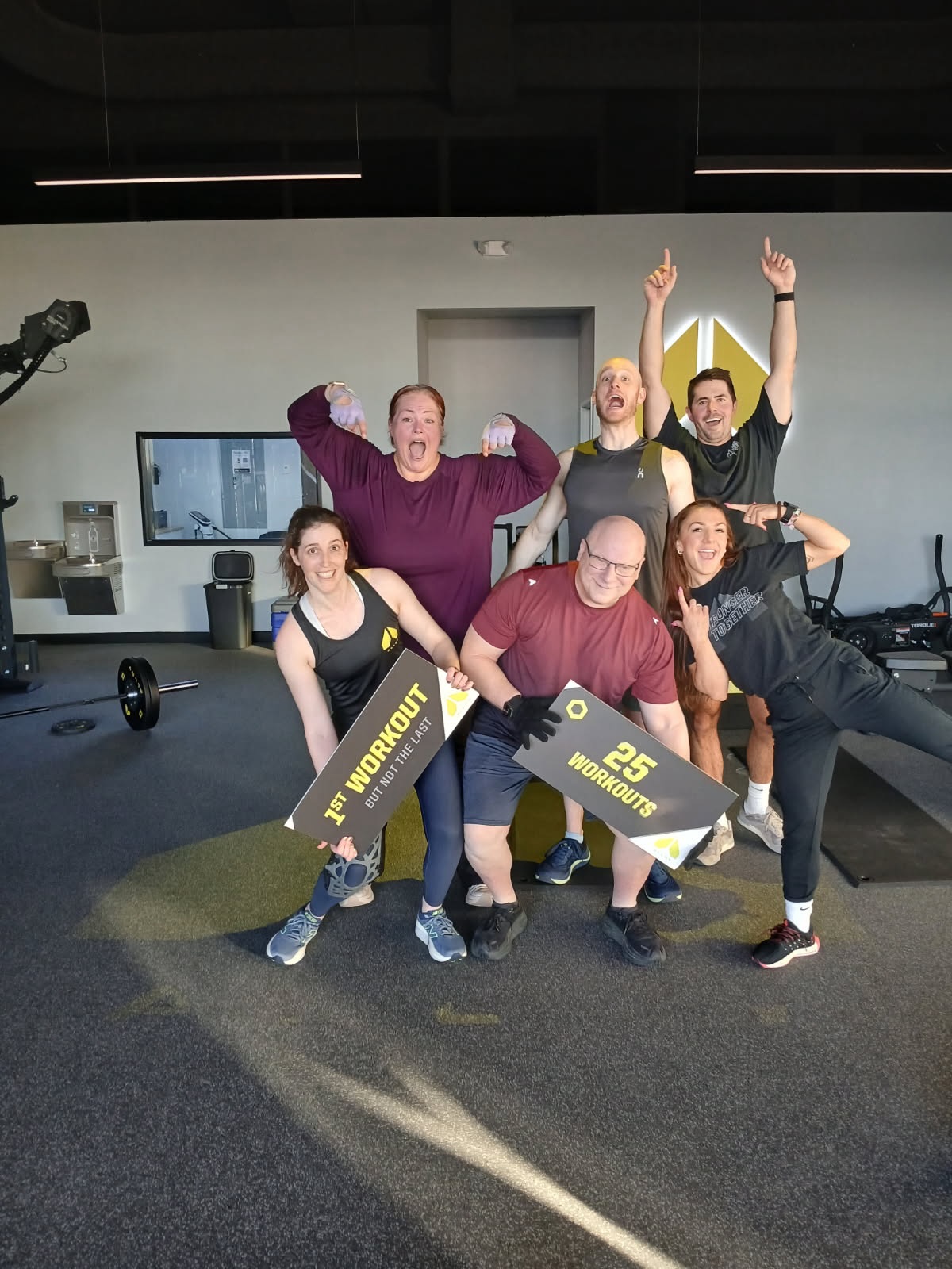 Two Alloy Personal Training Cedar Hills Crossing members posing in retro workout outfits during a small group fitness class led by certified personal trainers for adults over 40.
