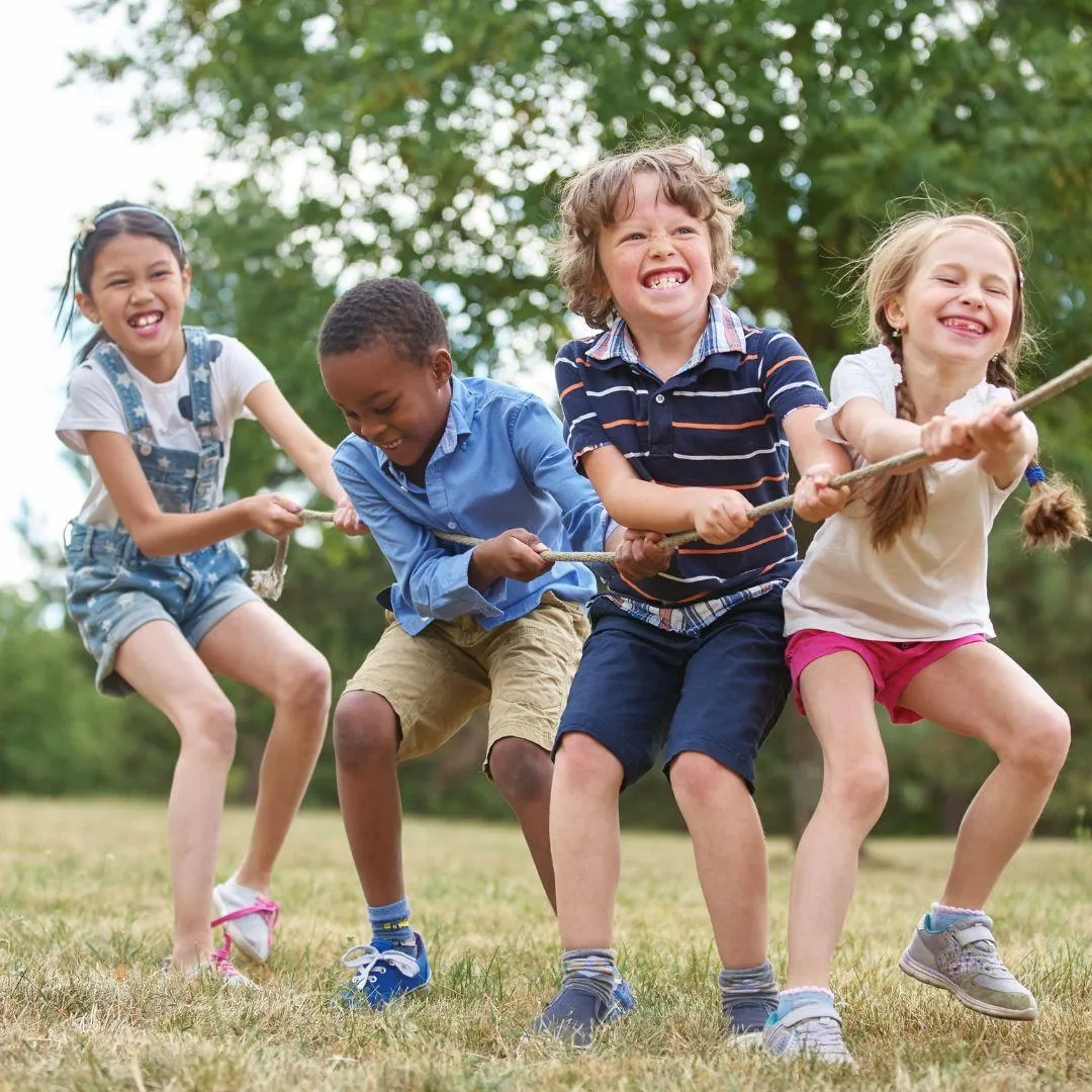 kids playing tug of war in childcare