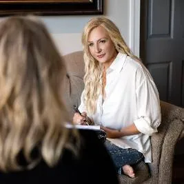 Relaxed client participating in an online hypnotherapy session from home