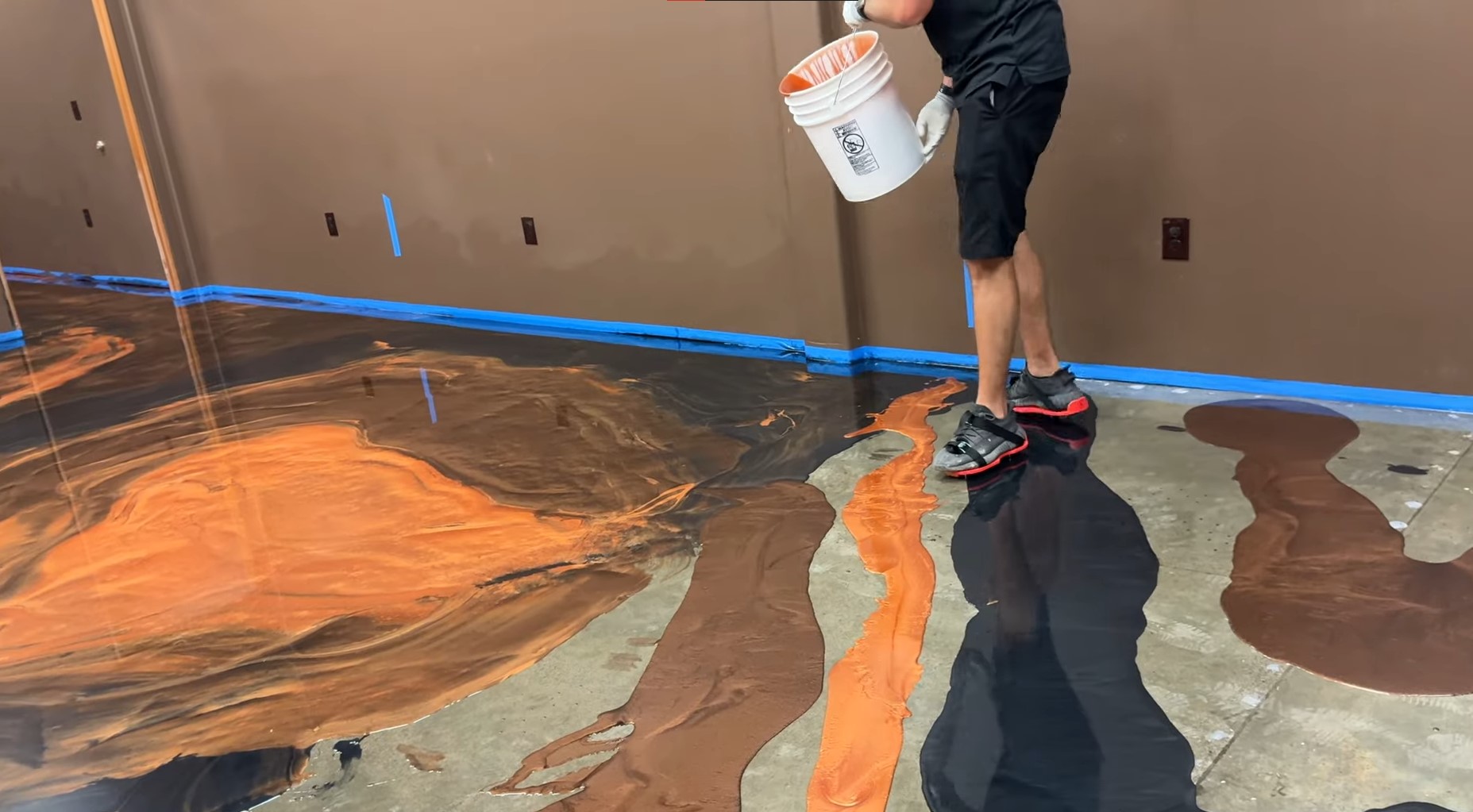 metallic epoxy preparation using orange, black, and brown colors