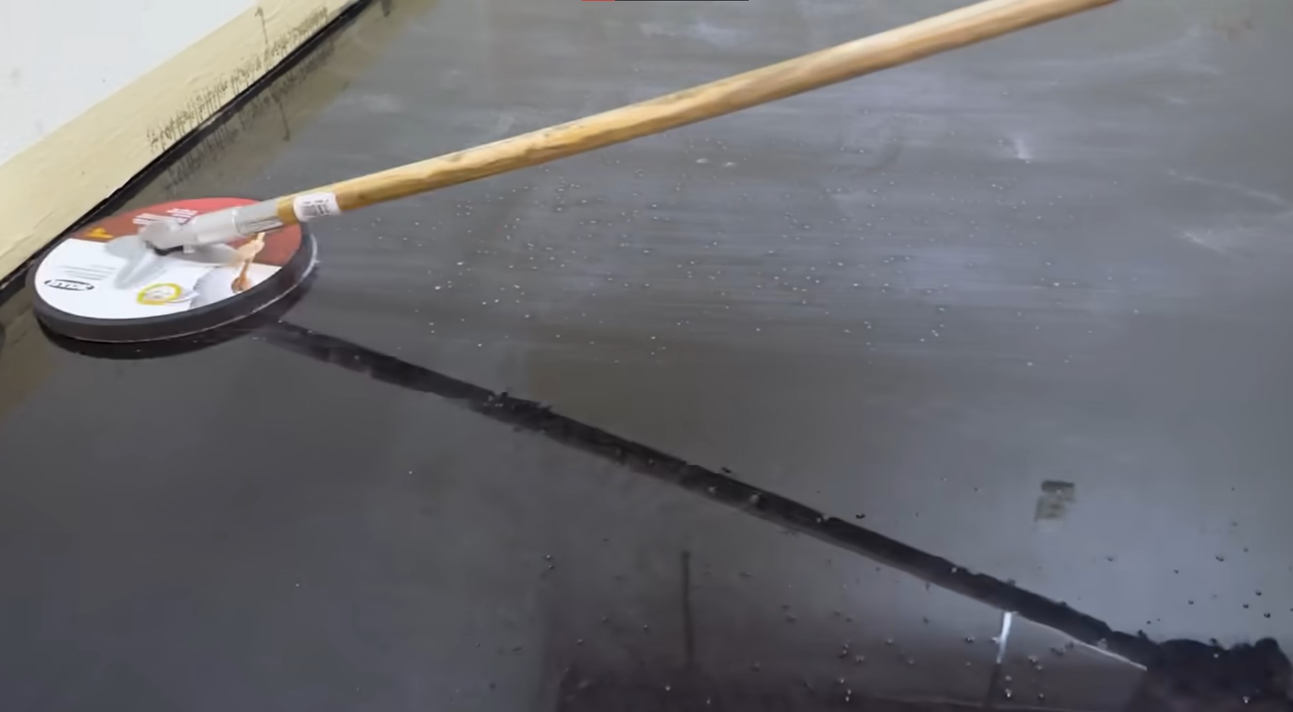slider over a black epoxy floor