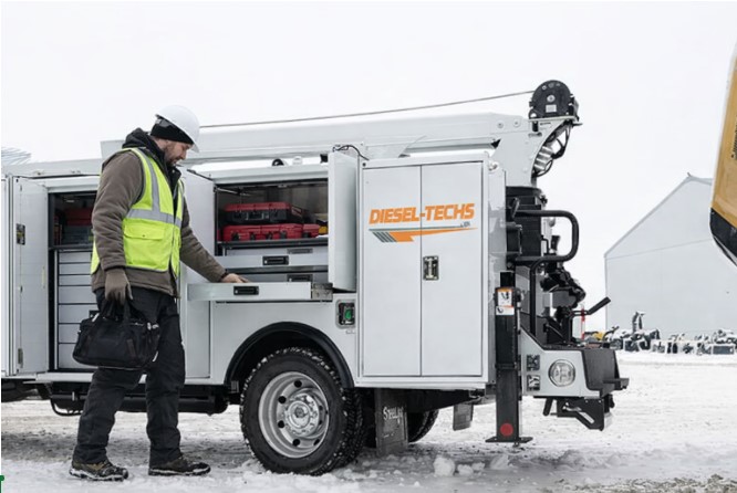 mobile diesel mechanic working on truck in field