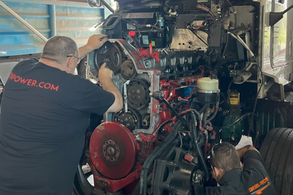mobile diesel mechanic in Northern Aberta working on highway truck