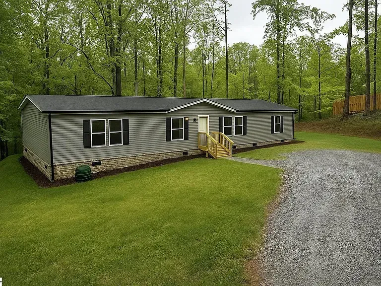 gray wooden door near green plants during daytime