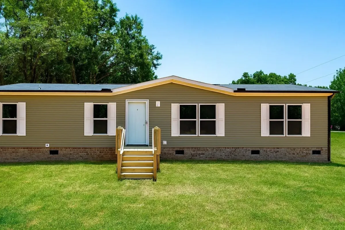 a living room with white furniture and wood floors