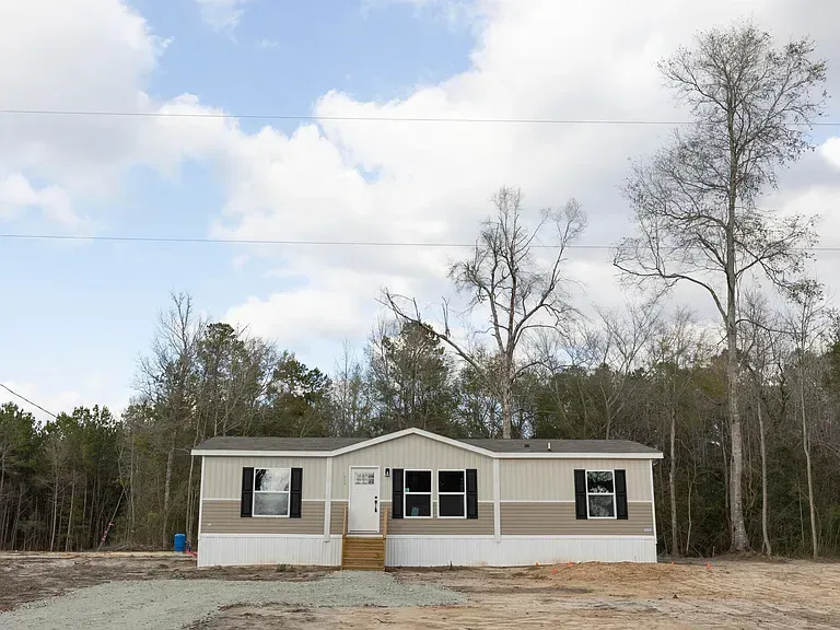 a modern house with a swimming pool at night