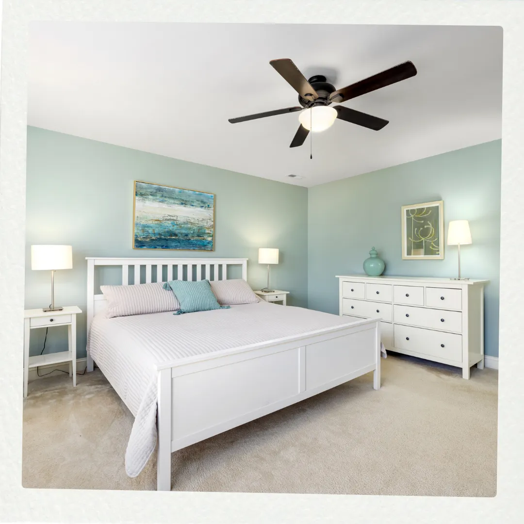 Phoenix Paintworks Mildura interior painting project showcasing a tranquil bedroom with expertly painted sage green feature walls, precision white trim work, and flawless ceiling application creating a sophisticated residential finish.