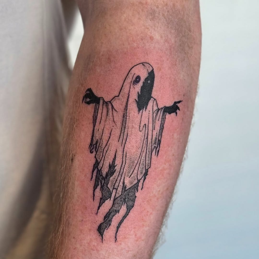 person in blue denim shorts and white nike sneakers standing on gray concrete floor