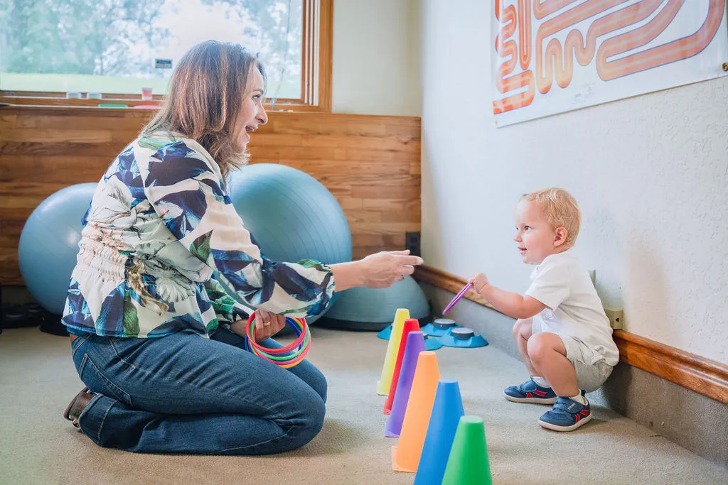 Dr. Karen Borman interacting with a young child at LifeMind Functional Neurology