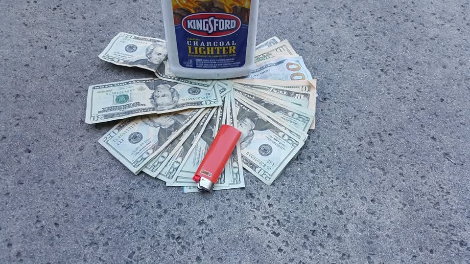Confident field technician leaning on a service van