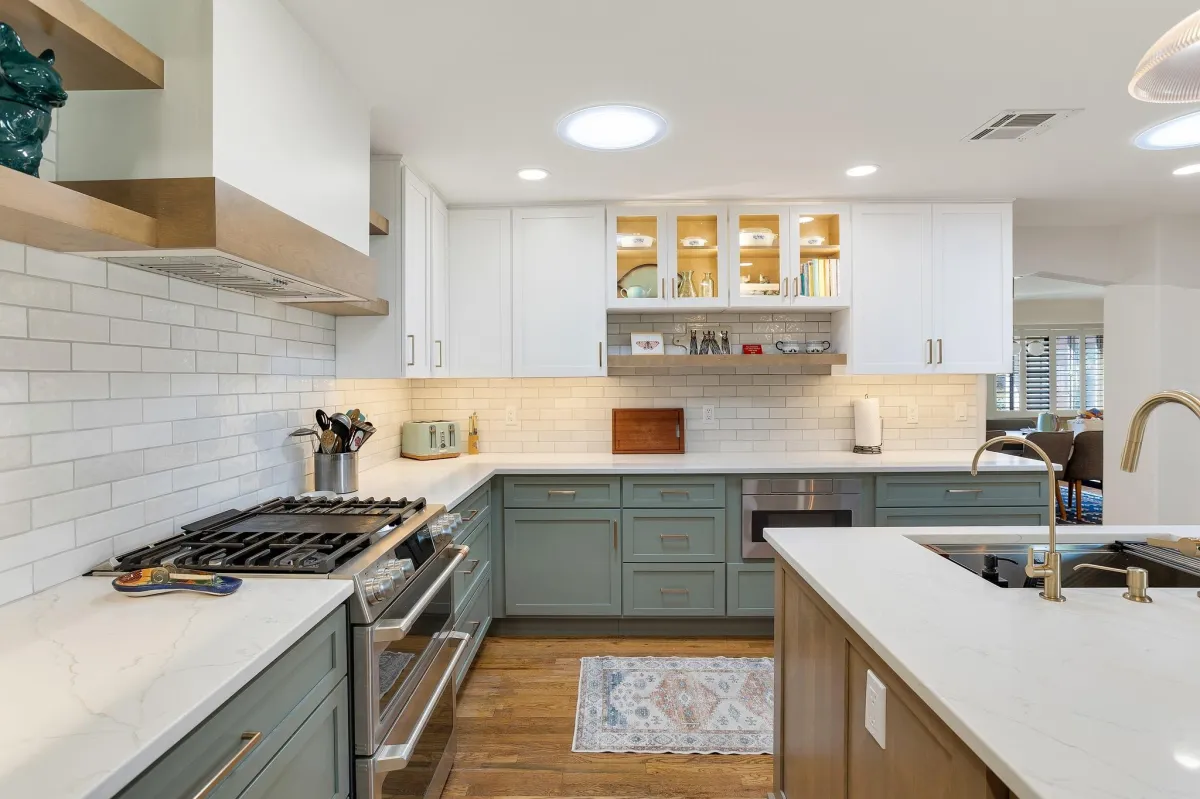 A large kitchen with a center island and a chandelier