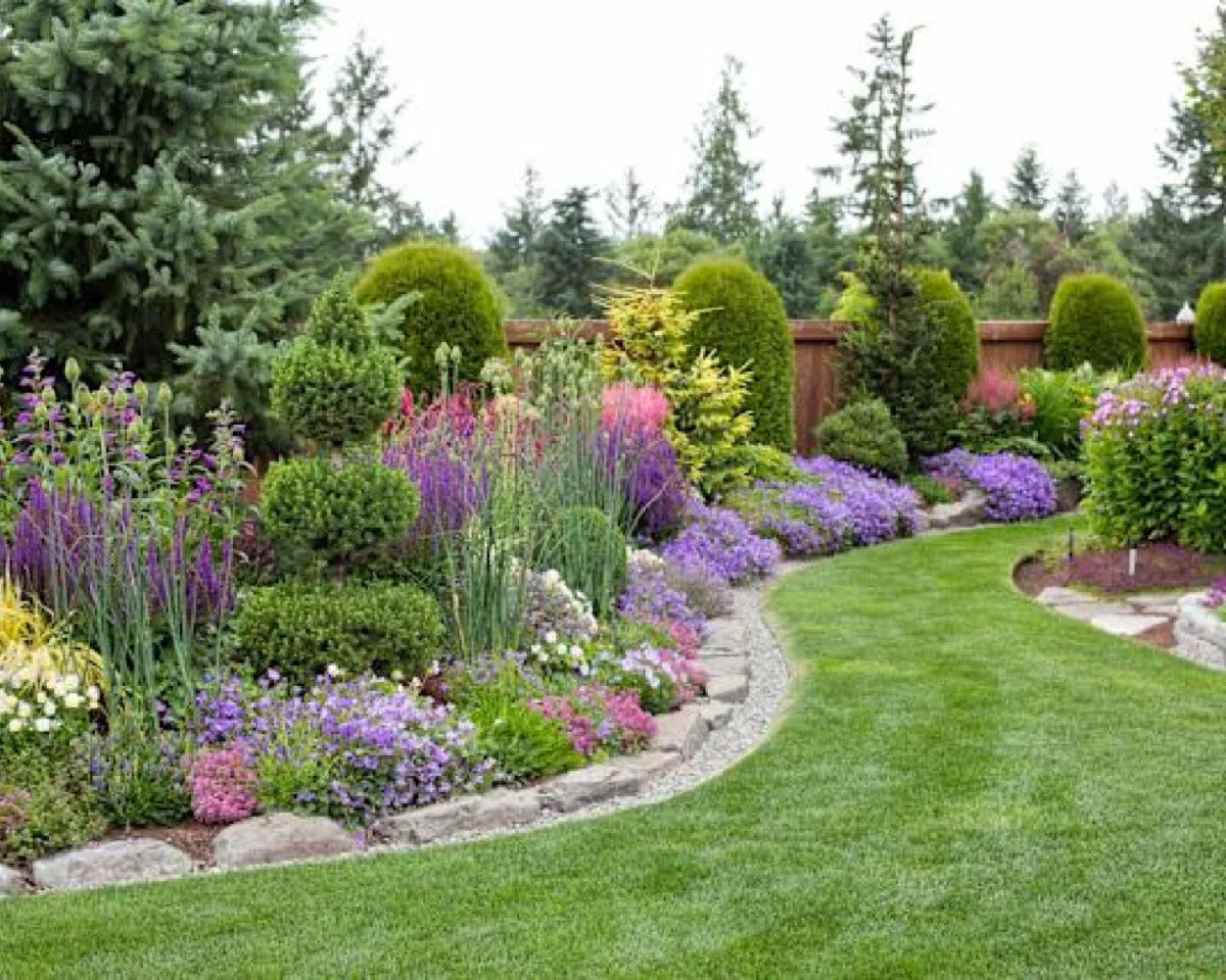 Maintained garden bed with native shrubs and grasses in Prebbleton