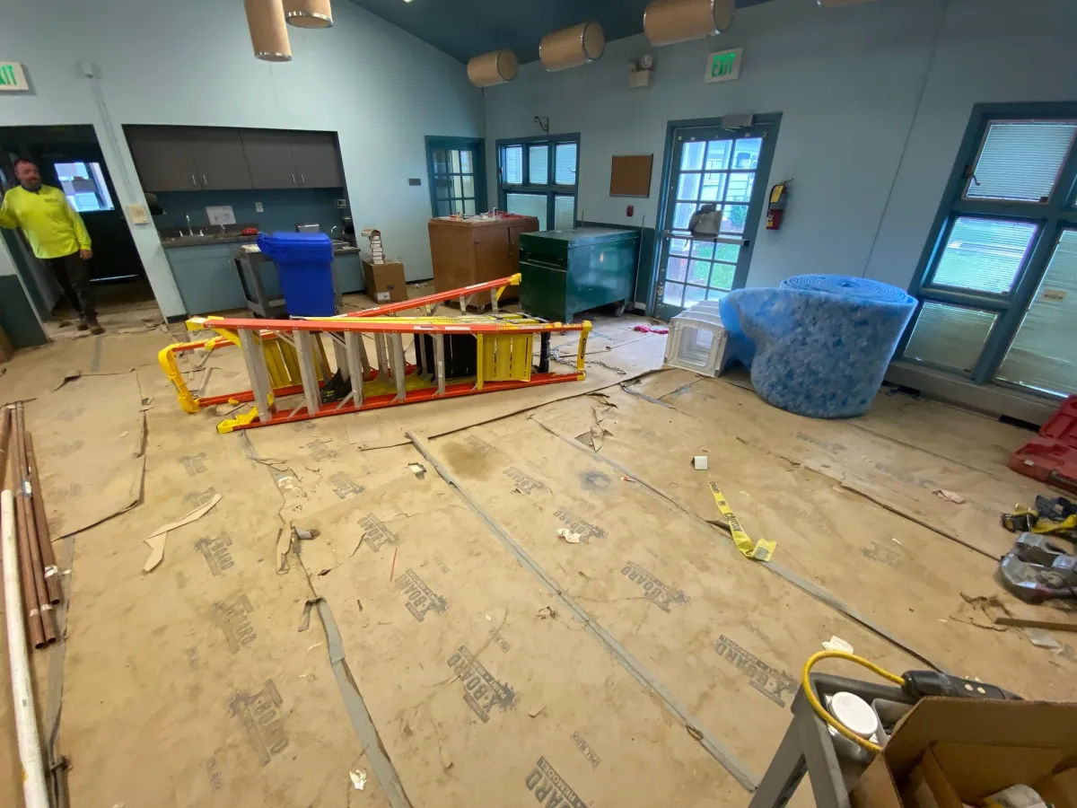 a room filled with lots of clutter and furniture