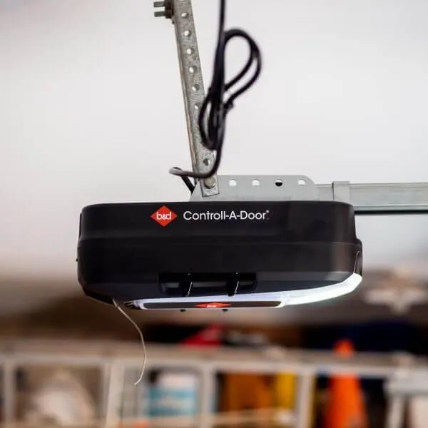 A B&D sectional garage door motor hanging from the ceiling with brackets 