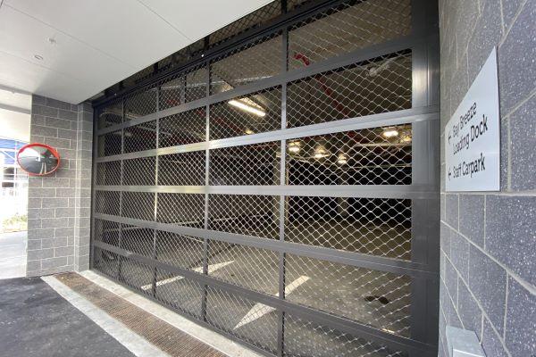 A custom styled garage door on a new home