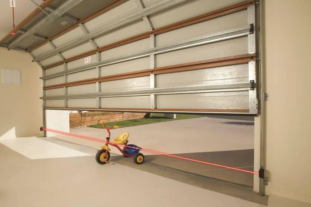 a garage door showing a laser beam at the bottom 